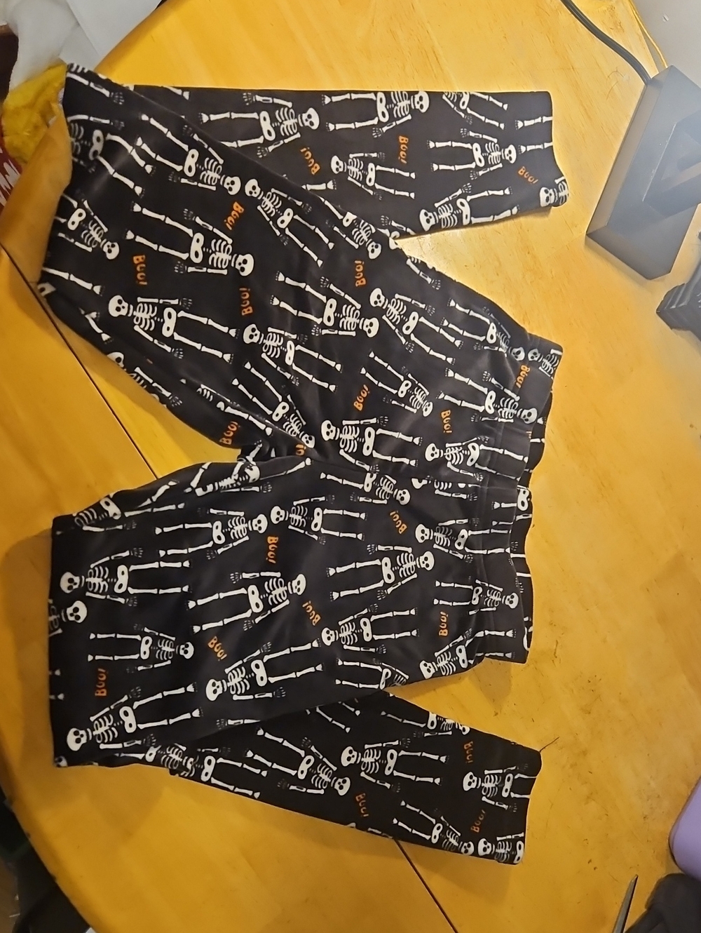 Black Skeleton Print Leggings with Orange Accents